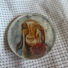 Load image into Gallery viewer, Round translucent decorative ornament featuring a bold goat design on a textured white background.