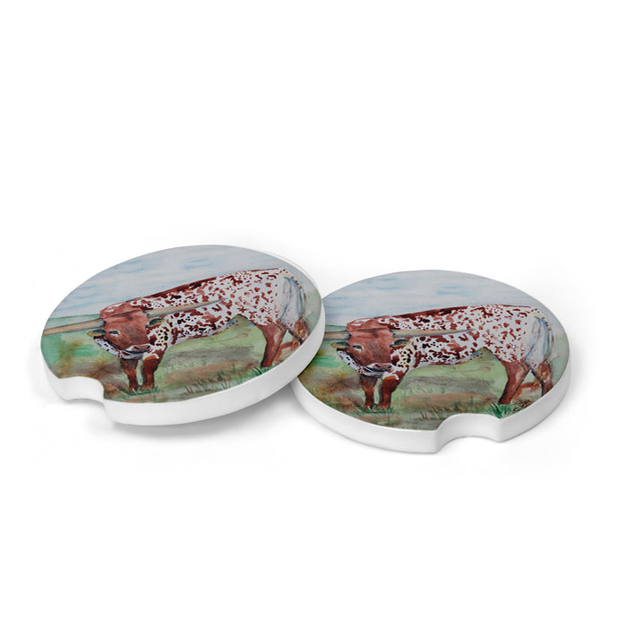 Two ceramic coasters with watercolor longhorn designs. Made in small batches, they soak up water and are easy to clean. Perfect gift for any occasion!