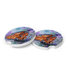 Load image into Gallery viewer, Handmade ceramic car coaster featuring a vibrant butterfly design&quot;
