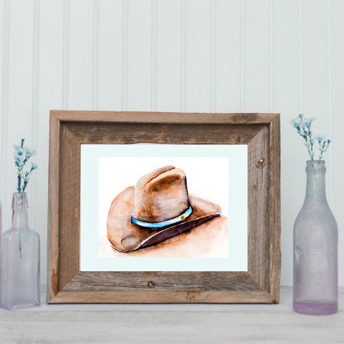 Original watercolor cowboy hat painting by Nichole Lorenzen - perfect for adding western charm to any room. Hand-painted with love at Lorenzen Farm, Oklahoma. High-quality craftsmanship, ideal for birthdays, holidays, and special occasions. Bring the beauty of the farmhouse home.