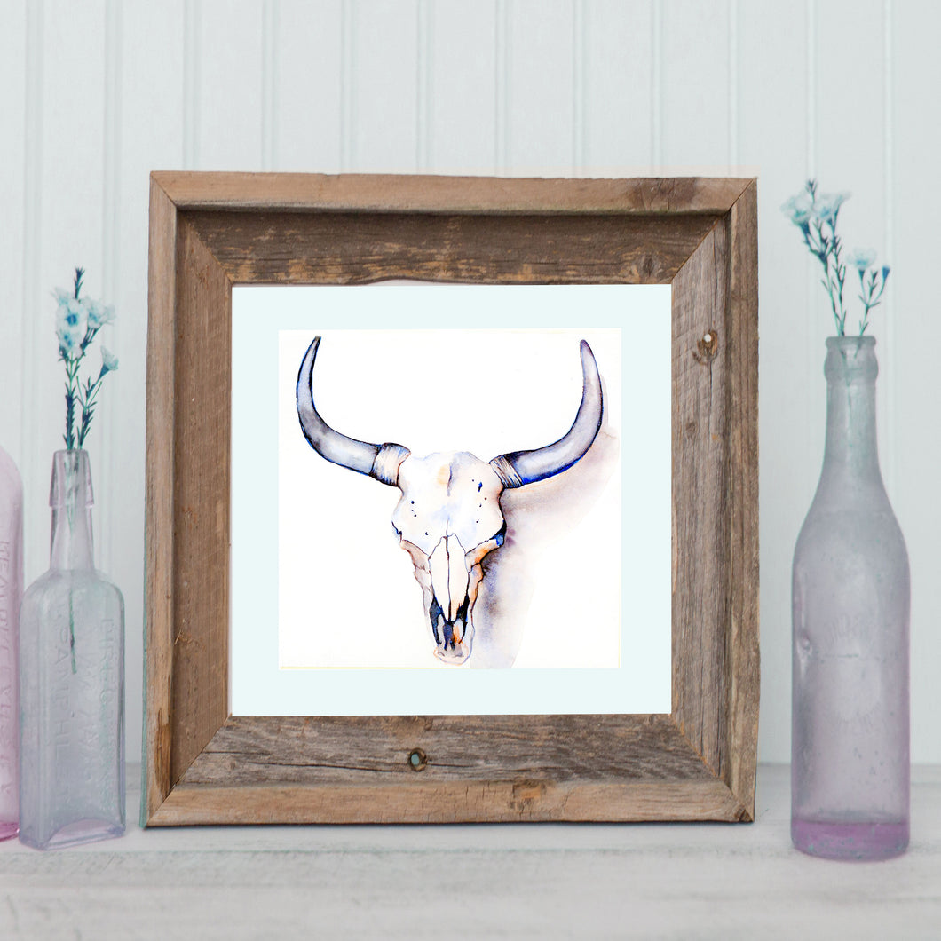 Handmade watercolor painting of a cow skull, capturing the rustic charm of the countryside by Nichole Lorenzen.