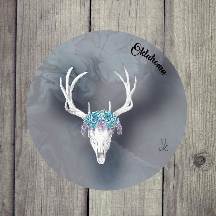 Close-up of absorbent ceramic coaster featuring a stylized deer skull with flowers, ideal for country-style spaces.