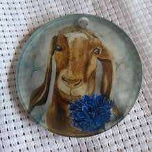Load image into Gallery viewer, Round translucent decorative ornament featuring a bold goat design on a textured white background.
