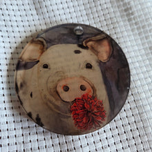 Load image into Gallery viewer, Round translucent decorative ornament featuring a bold pig design on a textured white background.

